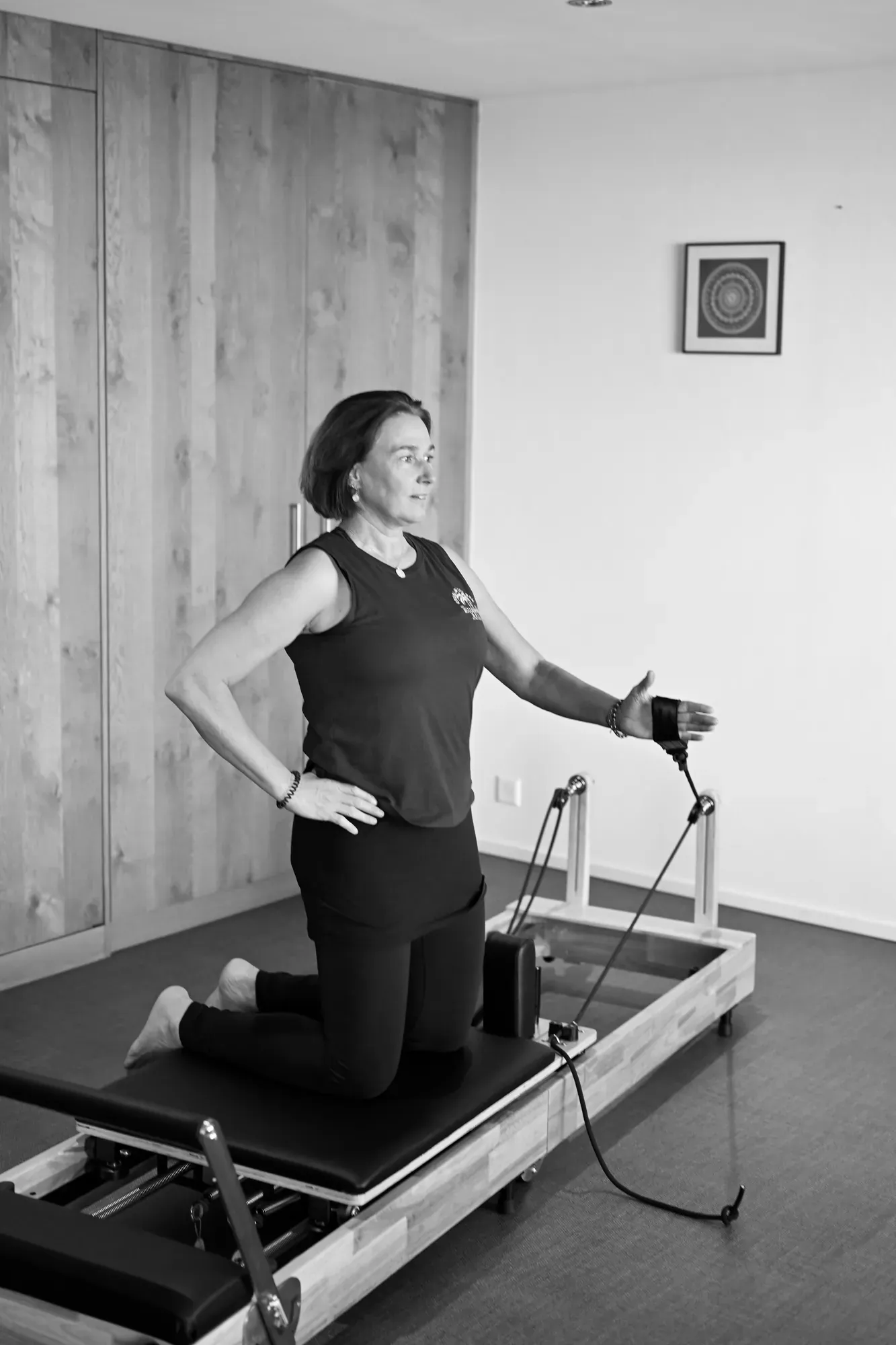 Kniende Übung mit Seilzug auf dem Reformer